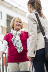 Portrait of senior woman communicating with her granddaughter - UUF002539