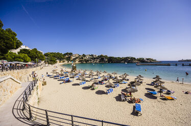 Spain, Mallorca, Porto Cristo, Beach with sunshades and beach loungers - THAF000858