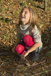 Germany, Bavaria, Landshut, happy girl in autumnal forest - YFF000263