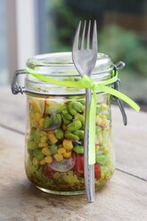 Vegetable salad with corn, fava beans and red radishes in preserving jar - HAWF000506