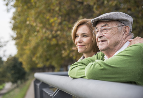 Confident senior man with daughter outdoors stock photo