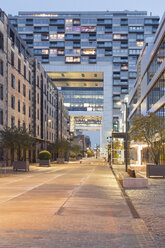 Germany, Cologne, crane houses and old warehouses at Zollhafen at dusk - MEM000472