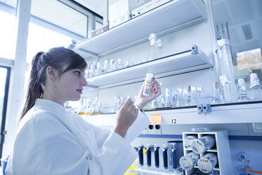 Young female natural scientist working at microbiology laboratory - SGF001054