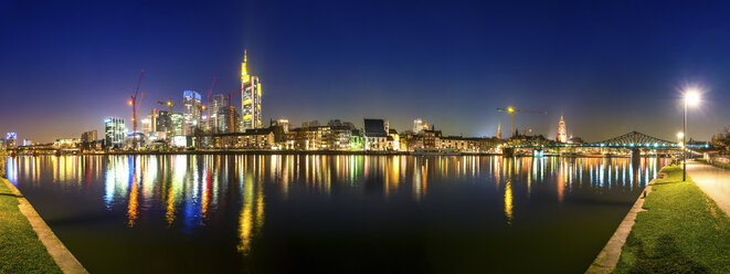 Germany, Hesse, Frankfurt, view to skylinewith Main River in the foreground at night - PUF000318
