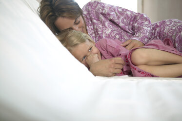 Mother and daughter relaxing in hotel spa - FSF000336