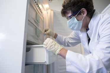 Female technician working at biochemistry labroratory - SGF001048