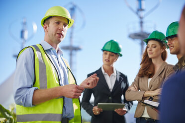 Business partners having a meeting with wind turbine engineer - ZEF002246