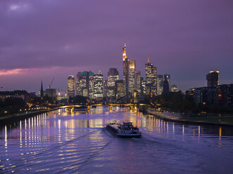 Germany, Hesse, View of Frankfurt am Main, Floesserbruecke and financial district at night - AMF003230