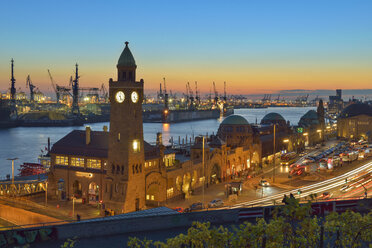 Germany, Hamburg, Port of Hamburg and Landungsbruecken at sunset - RJ000359