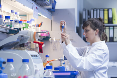 Young female natural scientist working at biological laboratory - SGF001082