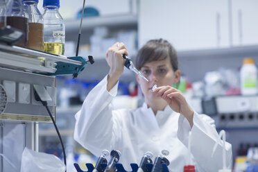 Young female natural scientist working at biological laboratory - SGF001088