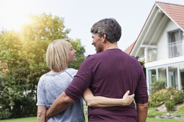 Rear view of mature couple in garden - RBF001932