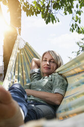 Relaxed mature woman in hammock - RBF001958