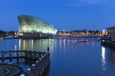 Netherlands, Amsterdam, Prins Hendrikade, Shipping Museum Nemo in the evening - FCF000510