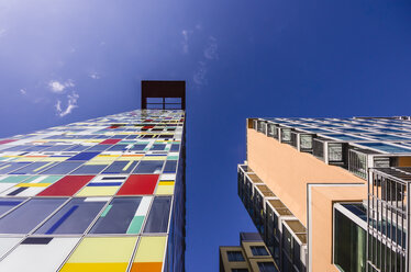 Germany, North Rhine-Westphalia, Duesseldorf, Colourful facade of office building, low angle view - THA000954