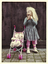 Girl with teddy and buggy - IPF000169