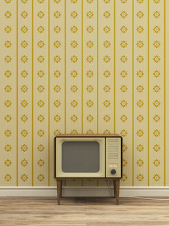 Old television in front of yellow patterned wallpaper - UWF000273