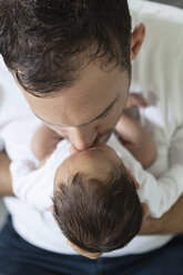 Young father kissing his newborn son - OJF000086