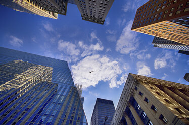 USA, Illinois, Chicago, view to facades of skyscrapers and low flying helicopter from below - SMAF000262