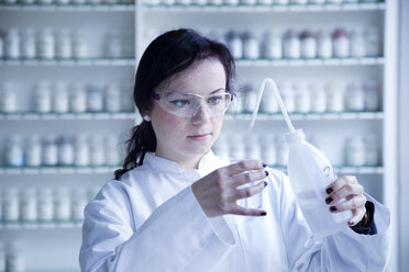 Portrait of young female scientist working in a biochemistry labroratory - SGF001172