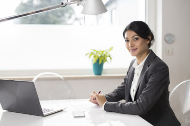 Portrait of smiling businesswoman at office - SHKF000036