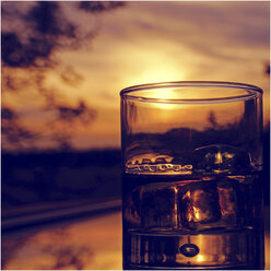 Whiskey on the rocks at sunset - HOHF001206
