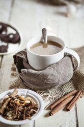 Bowl of Masala chai with almond milk on jute and wood - SBDF001478