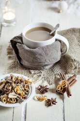 Bowl of Masala chai with almond milk on jute and wood - SBDF001481