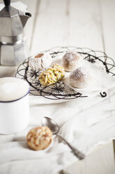 Mug of Cappuccino, Italian almond cookies and espresso can - SBDF001491