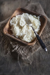 Sauerkraut in wooden bowl with fork, studio - SBDF001451