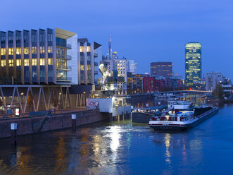 Germany, Hesse, Frankfurt, Gutleutviertel, Westhafen, Pier 1 in the evening, Westhafen Tower in the background - AMF003354