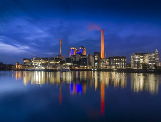Germany, Hesse, Frankfurt, Gutleutviertel, Westhafen, Cogeneration plant in the evening - AMF003349