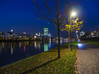 Germany, Hesse, Frankfurt, Theodor-Stern-Quay, Westhafen Tower at night - AMF003353