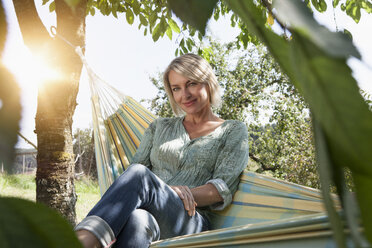 Woman relaxing in hammock - RBF002027