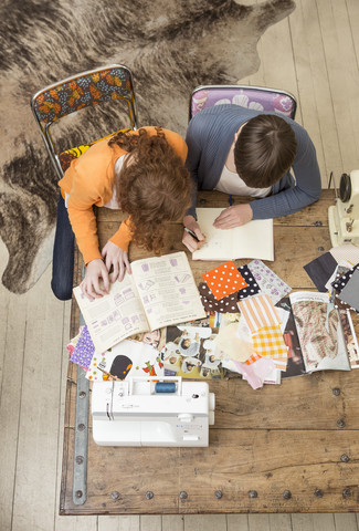 Two female fashion designers working together at their studio stock photo
