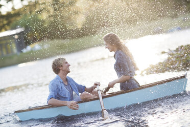 Young couple in a rowing boat on a lake - ZEF002345