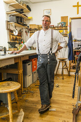 Saddler standing in his workshop - TCF004359