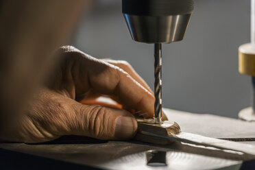 Knife maker in workshop at work - TCF004432