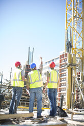 Three construction workers in construction site - ZEF001584