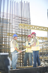 Construction workers talking in construction site - ZEF001589