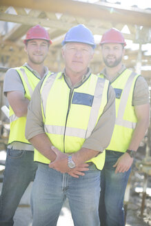 Portrait of confident construction workers in construction site - ZEF001644