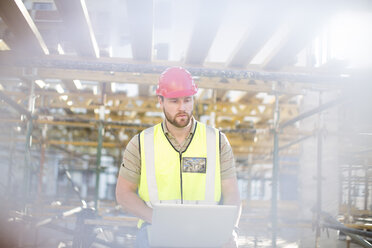 Construction worker using tablet on construction site - ZEF001647
