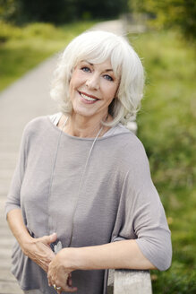 Portrait of smiling white haired senior woman - VRF000136