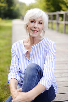 Portrait of smiling white haired senior woman - VRF000134