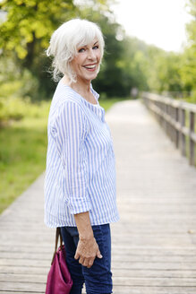 Portrait of smiling white haired senior woman - VRF000132