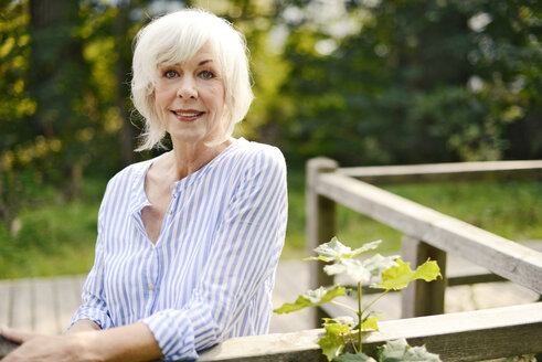 Portrait of smiling white haired senior woman - VRF000131