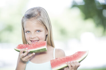 Portrait of little girl eating watermelon - ZEF002738