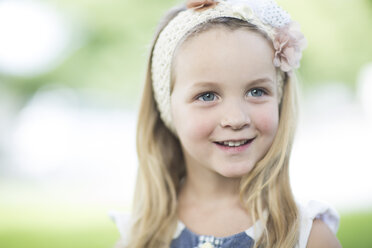 Portrait of smiling little girl in nature stock photo