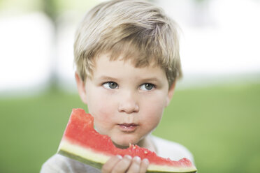 Portrait of little boy eating watermelon - ZEF002761