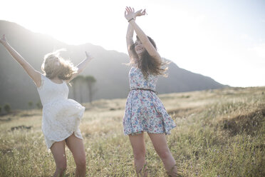 South Africa, Girl friends jumping of joy in field - ZEF002609